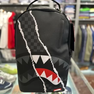 Center rip revealing gray check backpack sprayground