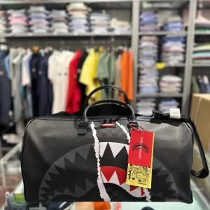 Center rip revealing gray check mini duffle sprayground